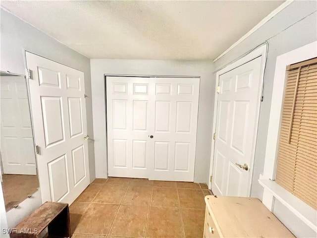 interior space featuring light tile patterned floors