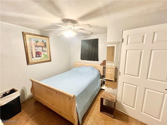 tiled bedroom featuring ceiling fan