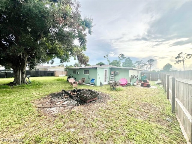 rear view of house featuring a lawn