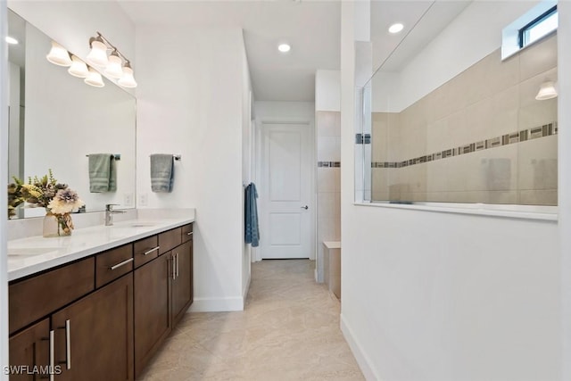 bathroom featuring vanity and a tile shower