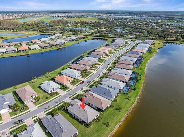 bird's eye view with a water view