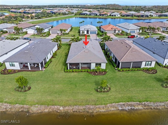 bird's eye view with a water view