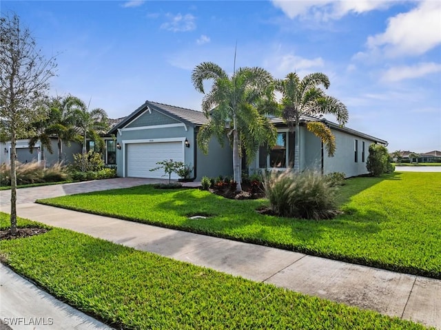 ranch-style home with a front lawn and a garage