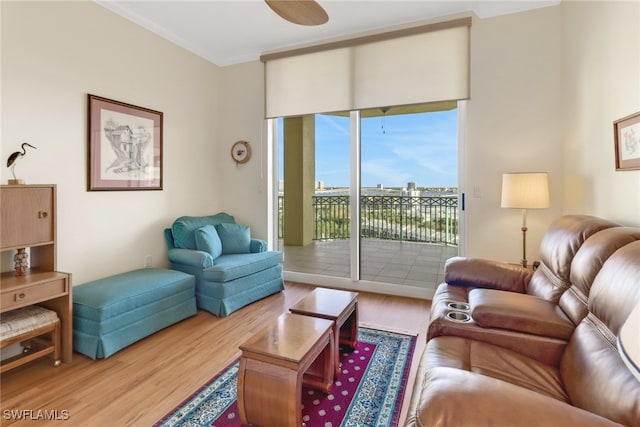 living room featuring crown molding and hardwood / wood-style floors