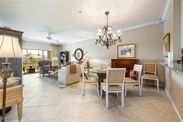 dining area featuring crown molding, light tile patterned floors, visible vents, baseboards, and ceiling fan with notable chandelier