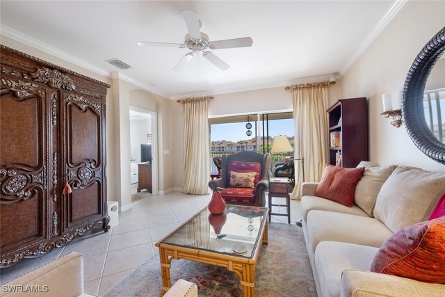 tiled living room featuring ceiling fan and ornamental molding