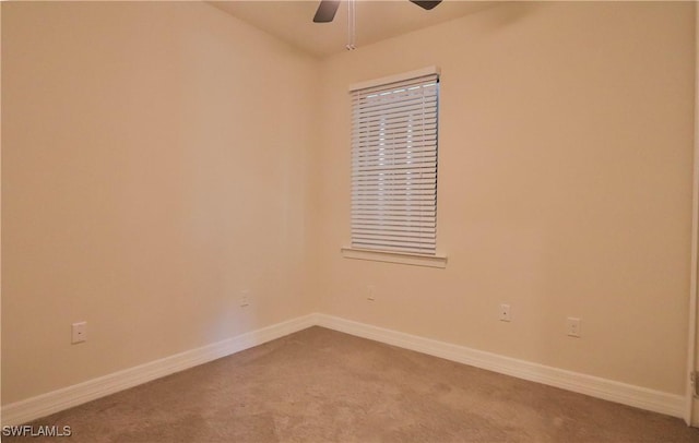 carpeted empty room with ceiling fan