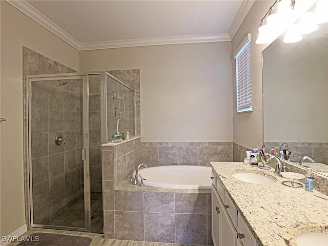 bathroom with vanity, shower with separate bathtub, and crown molding