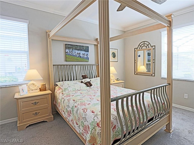 carpeted bedroom with ceiling fan, ornamental molding, and multiple windows