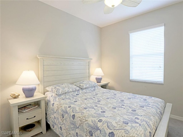 bedroom with multiple windows, carpet floors, and ceiling fan