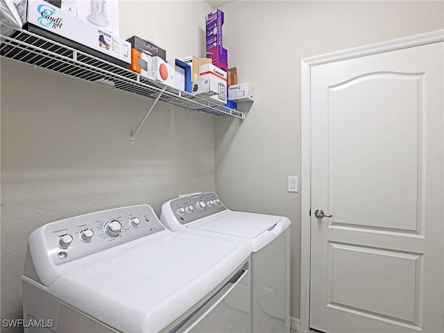 laundry area featuring separate washer and dryer