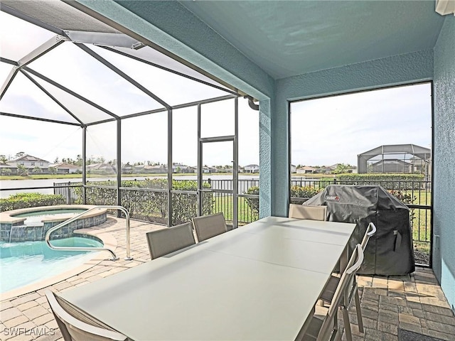 sunroom featuring a healthy amount of sunlight and a swimming pool