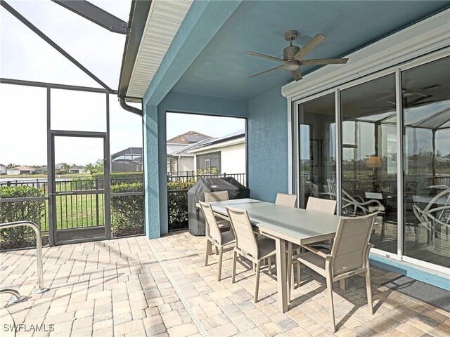 sunroom / solarium with ceiling fan