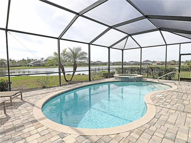 view of swimming pool featuring glass enclosure, an in ground hot tub, a water view, and a patio