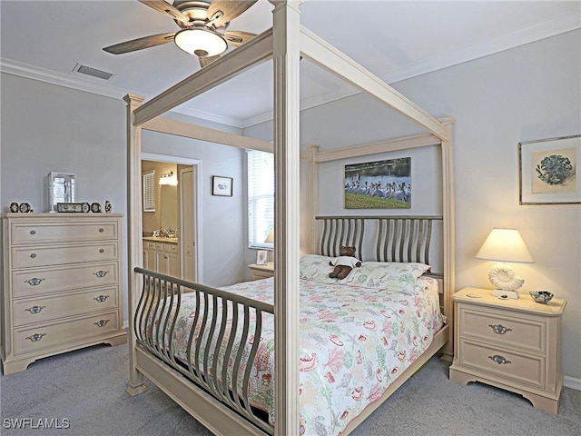 carpeted bedroom featuring connected bathroom, ceiling fan, and ornamental molding