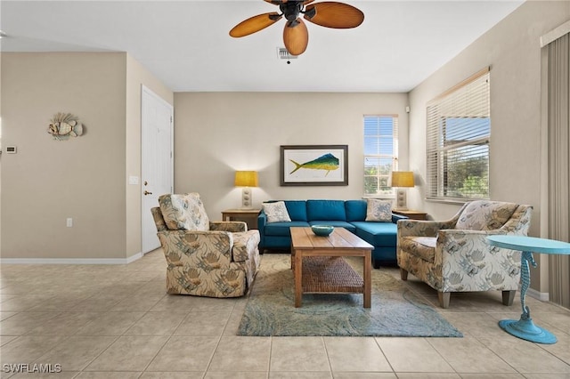 tiled living room featuring ceiling fan