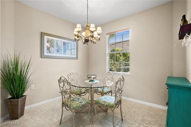 dining room featuring light tile patterned flooring and a chandelier