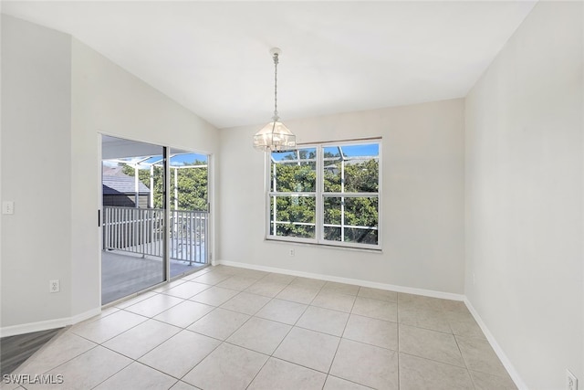 unfurnished dining area featuring light tile patterned floors, lofted ceiling, and a chandelier