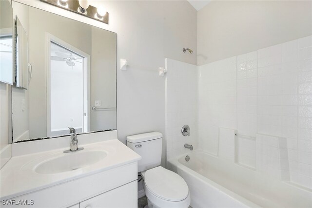 full bathroom with toilet, ceiling fan, vanity, and bathtub / shower combination