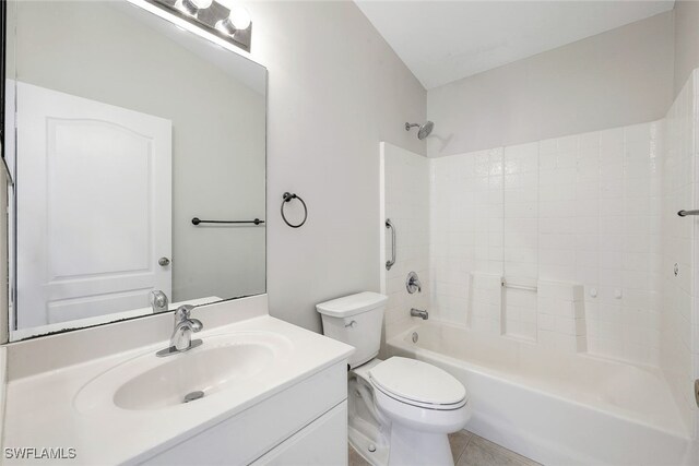 full bathroom with shower / bathing tub combination, vanity, tile patterned floors, and toilet