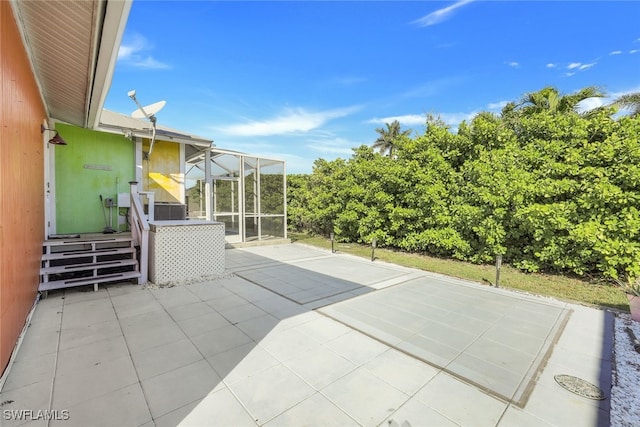 view of patio with a lanai