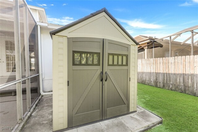 view of outdoor structure with a lawn