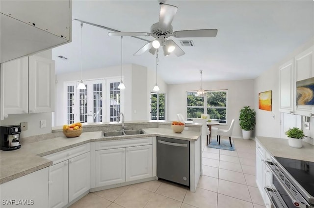 kitchen featuring appliances with stainless steel finishes, pendant lighting, white cabinetry, and sink