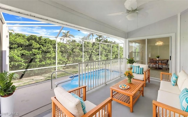 sunroom / solarium with ceiling fan and vaulted ceiling