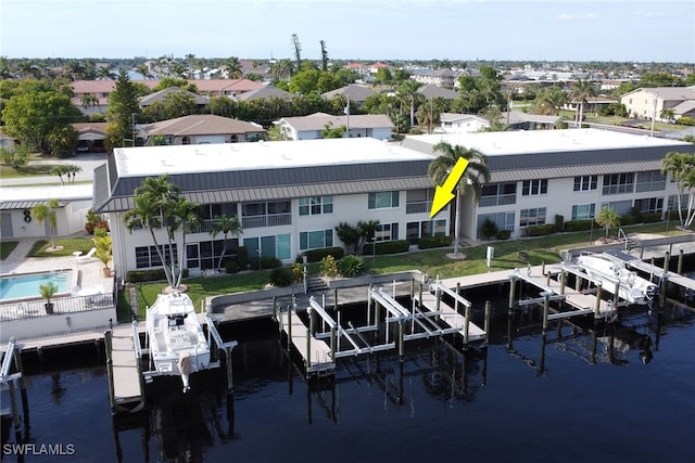 birds eye view of property featuring a water view