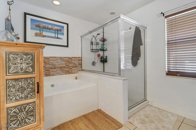 bathroom with tile patterned flooring and plus walk in shower