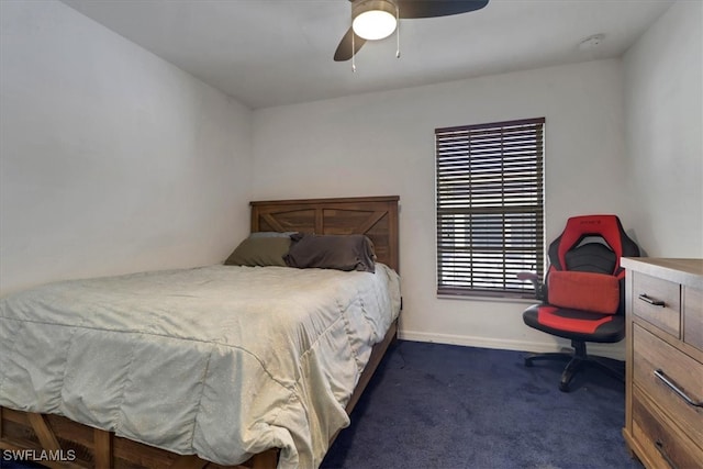 bedroom with dark carpet and ceiling fan