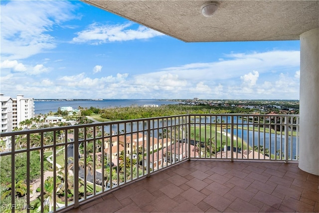 balcony featuring a water view