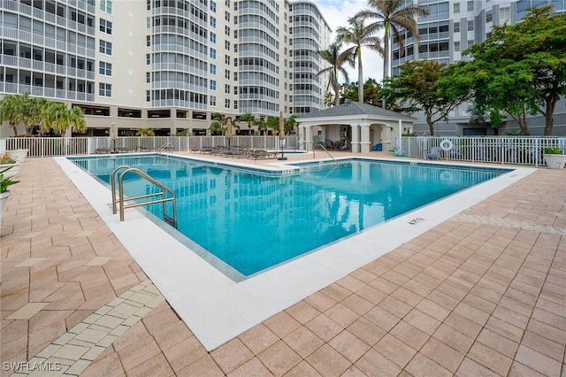 view of swimming pool with a patio