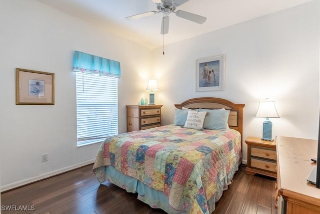 bedroom with dark hardwood / wood-style floors and ceiling fan