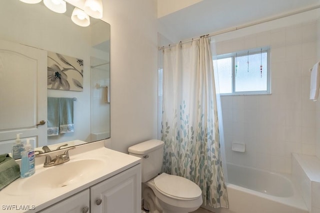 full bathroom with shower / tub combo with curtain, vanity, and toilet