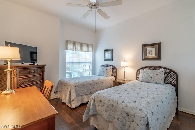 bedroom with ceiling fan and dark hardwood / wood-style flooring