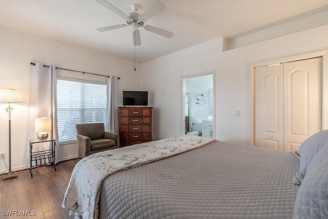 bedroom featuring hardwood / wood-style floors, ceiling fan, ensuite bath, and a closet