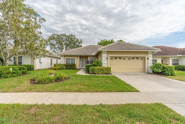 view of front of home featuring a garage and a front yard