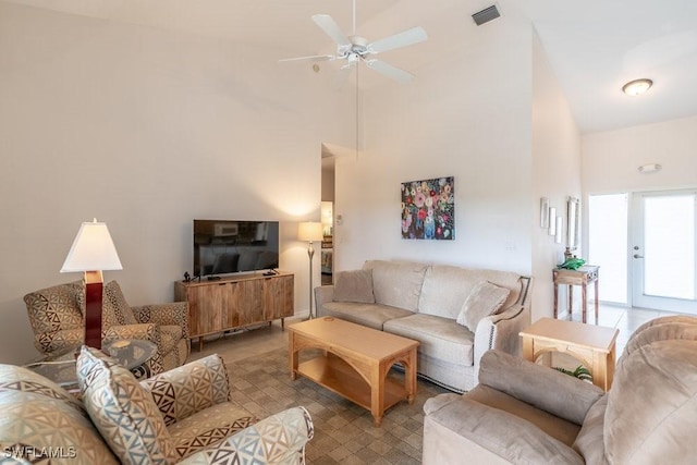 living room featuring ceiling fan and high vaulted ceiling