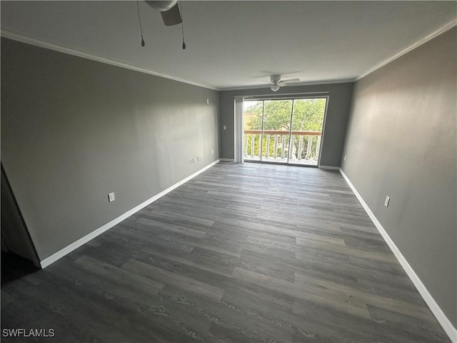 empty room with ceiling fan, dark wood-type flooring, and ornamental molding