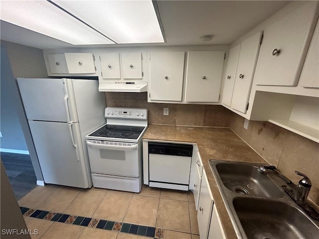 kitchen with sink, tasteful backsplash, light tile patterned flooring, white appliances, and white cabinets