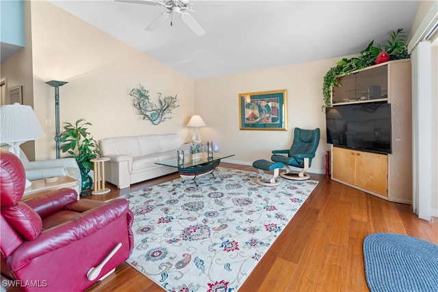 living room featuring hardwood / wood-style flooring and ceiling fan