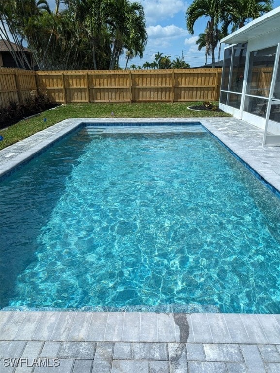 view of pool with a sunroom