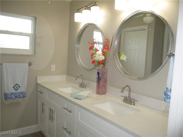 bathroom featuring plenty of natural light and vanity