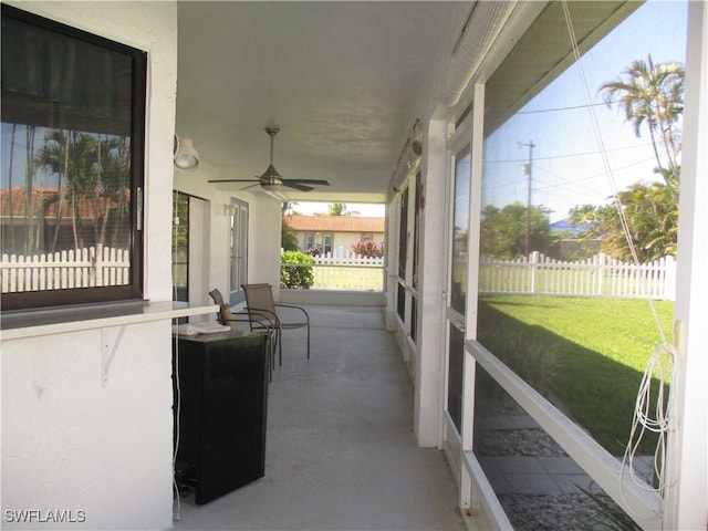 sunroom / solarium with ceiling fan