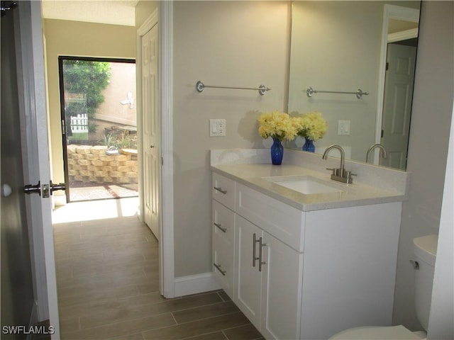 bathroom with vanity and toilet