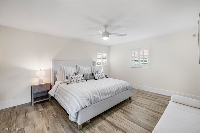 bedroom featuring wood-type flooring and ceiling fan