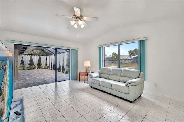 living room with ceiling fan and light tile patterned floors