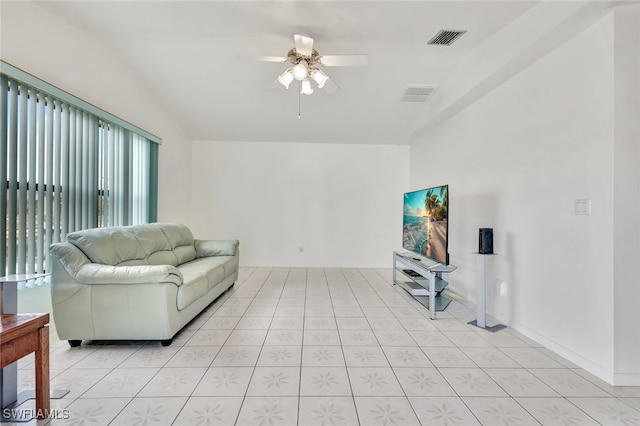 living room featuring ceiling fan and light tile patterned floors