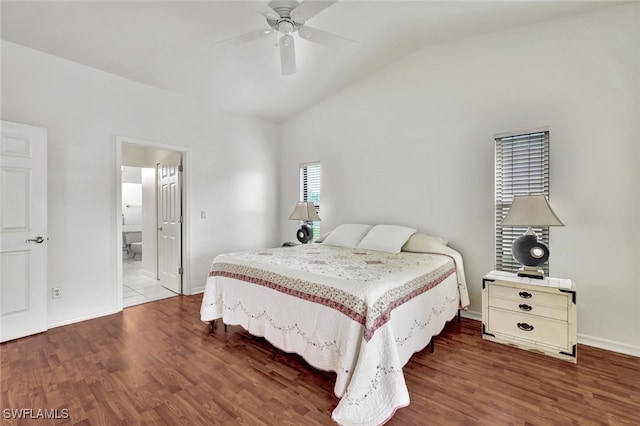 bedroom with ceiling fan, lofted ceiling, ensuite bathroom, and wood-type flooring